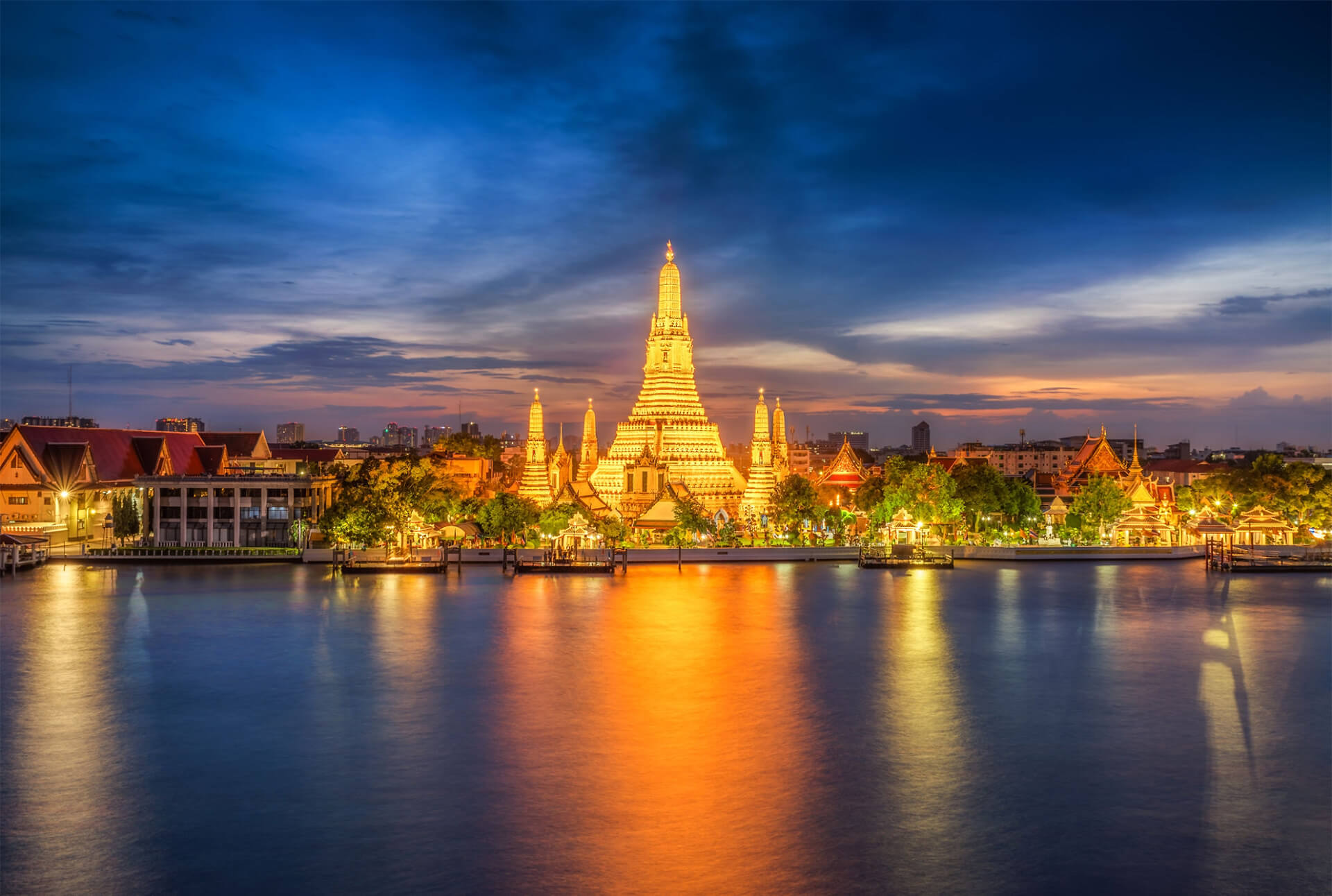https://explorekuwait.com/wp-content/uploads/2021/02/1177404879-sunset-city-skyline-at-Wat-Arun-temple-and-Chao-Phraya-River-Bangkok.jpg
